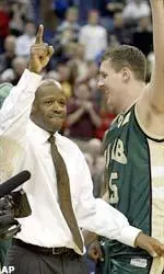 Head Coach Mike Anderson (left) and now-departed senior Lee Cobb celebrate last season's 76-75 upset of No. 1 seed Kentucky.