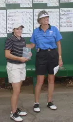 Senior Brooke Mangan receives her second career individual title award from Georgia State coach Cathy Mant.