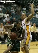 Demario Eddins drives against a USC defender. The junior scored 11 points in the game. Photo by Barry Markowitz.
