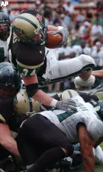 Dan Burks scores a touchdown against Hawaii during the first quarter of the Hawaii Bowl