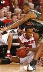 Morris Finley puts defensive pressure on Louisville's Otis George.