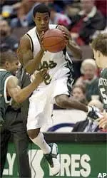 Ronell Taylor saves the ball from going out of bounds against Charlotte