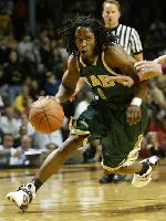 Squeaky Johnson drives against Minnesota. Photo by Brad Person.