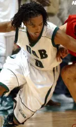 Carldell Johnson reaches for a loose ball in the final minute of Louisville's 77-73 win.