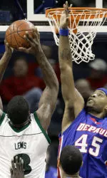 DePaul's Quemont Greer tries to block a shot by UAB's Marques Lewis in the first half.