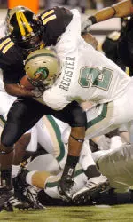 Brandon Register stops Southern Mississippi running back Tory Harrison for short yardage during the second quarter.