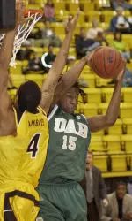 Frank Holmes grabs a rebound away from Southern Mississippi forward Mildon Ambres during the first half.