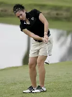 Janey Deimling watches one of her puts during the Papa Johns Collegiate. Photo by J.C. Ridley.