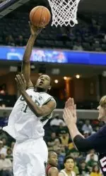 Lawrence Kinnard scores two of his 12 points against SMU Thursday. (AP Photo/Mary Ann Chastain)