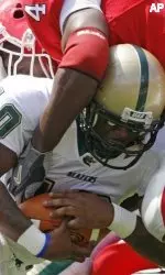 UAB quarterback Chris Williams, right, is tackled by Georgia's Roderick Battle during the first half. (AP Photo/Todd Bennett)