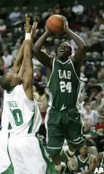 Robert Vaden shoots over Marshall's Tirrell Baines during the second half.