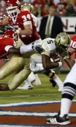 Joe Webb breaks through for a touchdown against Houston. (AP Photo/Houston Chronicle)