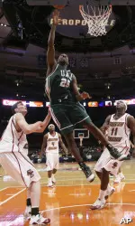 Channing Toney puts up a shot against Boston College defenders Joe Trapani, Tyrese Rice, Corey Raji and Rakim Sanders in the first half.(AP Photo/Julie Jacobson)