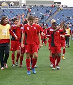 Forward/midfielder Dejan Jakovic leads Canada off the pitch following a victory over Guatemala in the consolation match.