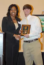 Associate Athletics Director for Academic Services Danez Marrable presented baseball senior Brandon Wallace with the Top Male GPA award.