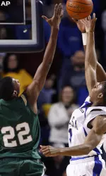 UAB's Cameron Moore, left, and Tulsa's Ben Uzoh and Ray Reese, right, reach for a rebound during the first half. (AP Photo/Tulsa World, Stephen Holman)
