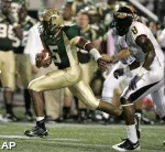 UAB quarterback Joe Webb (5) scrambles for a touchdown past Southern Mississippi defender Justin Wilson. (AP)