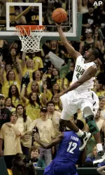Paul Delaney III skies past Tyreke Evans for a lay-up. (AP Photo/Butch Dill)