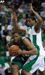 Marshall's Nigel Spikes, right, defends UAB's Kenneth Cooper during the first half of an NCAA college basketball game on Saturday, Jan. 23, 2010, at the Cam Henderson in Huntington, W.Va. (AP Photo/Randy Snyder)