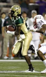 UAB quarterback David Isabelle (17) outruns Florida Atlantic's Keith Reaser for a touchdown during the first half an NCAA college football game on Thursday, Sept. 2, 2010, in Birmingham, Ala. (AP Photo/ Butch Dill)