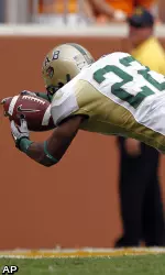 UAB wide receiver Mike Jones (22) dives into the end zone for a touchdown as Tennessee defender Anthony Anderson (36) hangs on in the first quarter of an NCAA college football game on Saturday, Sept. 25, 2010, in Knoxville, Tenn. (AP Photo/Mark Humphrey)