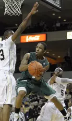 Aaron Johnson, center, passes the ball.