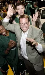 First-year head coach Jerod Haase makes a grand entrance at Hoops On The Haase-phalt on Friday night.