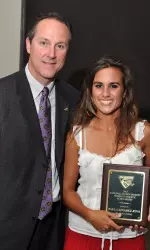 Brian Mackin awards women's tennis player Paula Alvarez with the National Alumni Society Women's Athletic Scholarship.