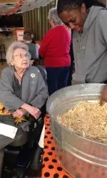 Senior Ashley Grimes helps find a needle in the haystack.