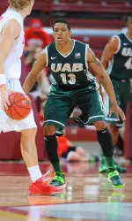 Chad Frazier playing defense against No. 19 New Mexico. Frazier scored 34 points in the contest against the Lobos.