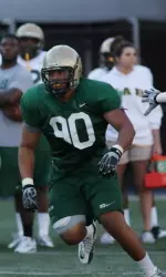 Defensive end Chris Walton rushes the quarterback in a spring drill. McGee says he is pleased with the defensive line's progression so far.