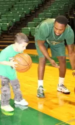 UAB men's basketball adopted Elijah before the 2012-13 season. They will honor him by wearing opposite colored shoes this season.