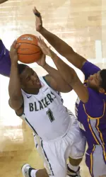 UAB guard Denzell Watts goes through two East Carolina defenders on Saturday.