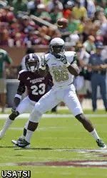 Kennard Backman reaches out for a reception while guarded by Bulldogs defensive back Taveze Calhoun.