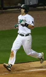 Freshman Carter Pharis scores UAB's lone run Tuesday night.