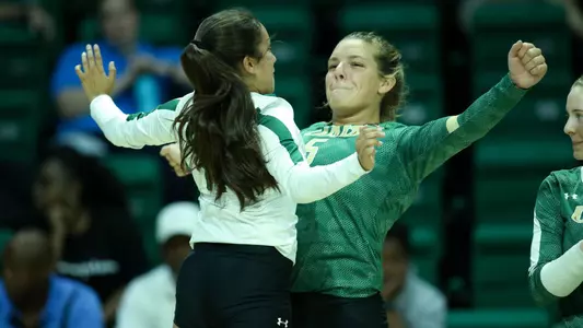 Abby-Brianna chest bump