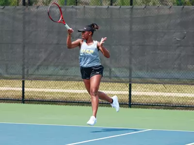 Sydney Clarke hits a forehand.