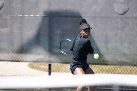 Sydney Clarke hits a backhand.