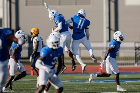 FUQUA CELEBRATES HIS INTERCEPTION