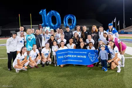 Coach Shawn Burke celebrates 100 career wins with the team