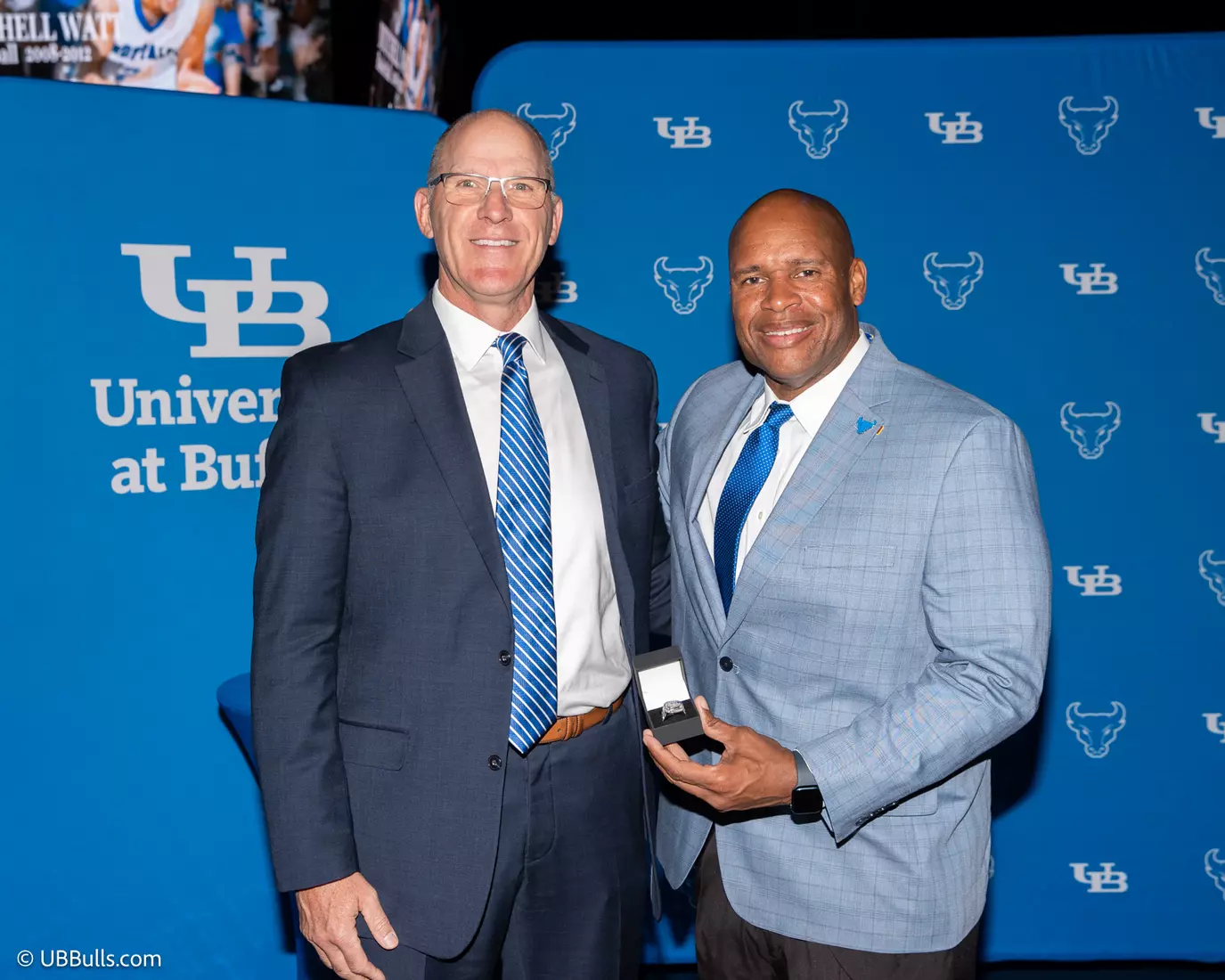 Former UB Men's Basketball Assistant Coach Jim Kwitchoff accepts Mitchell Watt's Hall of Fame ring.