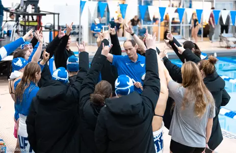 BASHOR HUDDLES WITH THE TEAM