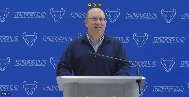 Pete Lembo speaking at podium