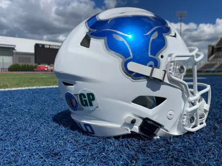 White UB football helmet on the football field
