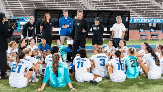 Head coach Shawn Burke talks to the team