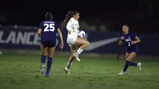 Taylor Esparza plays a ball surrounded by CBU defenders in a 2026 match