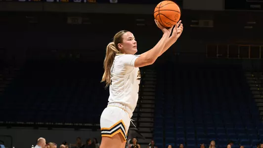 Lauryn Madsen shoots the ball during an NCAA women's basketball game.