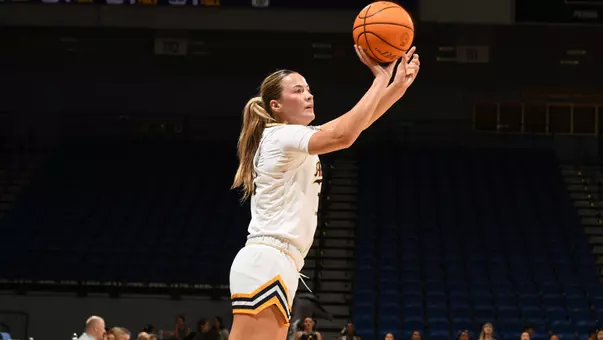 Lauryn Madsen shoots the ball during an NCAA women's basketball game.