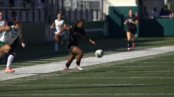 Mimi Dominguez turns upfield in a 2026 match at Cal Poly