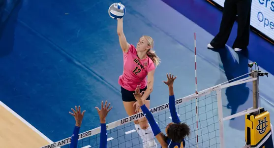 Bird's eye view of Madison Triplett making contact with the ball on an attack from the pin in an NCAA women's volleyball match.